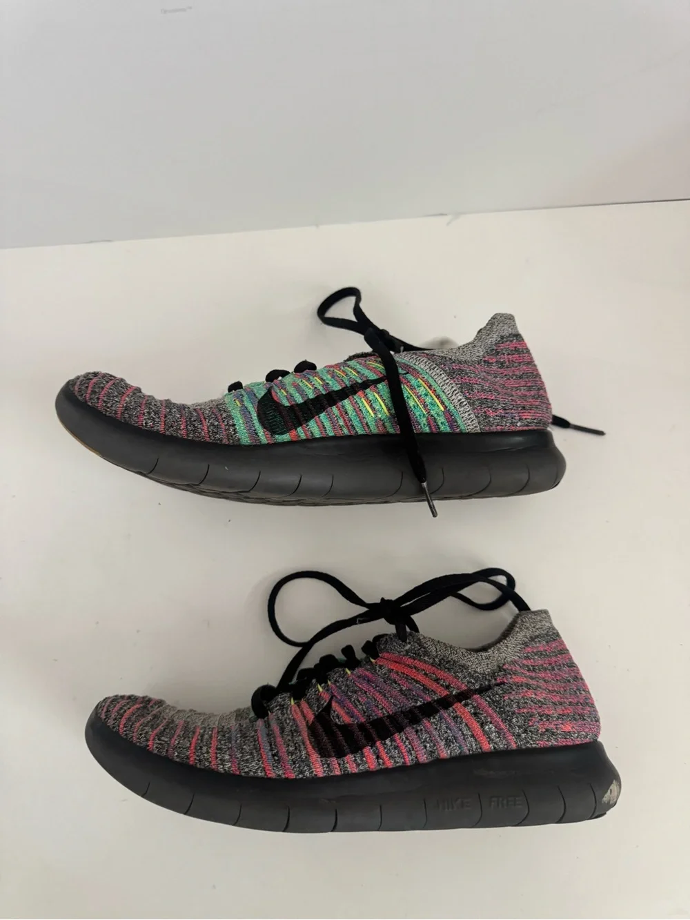 Nike Women’s Gray Knit Running Shoes with Pink and Green Accents